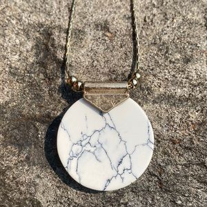 Necklace, marble stone with long gold tone chain.
